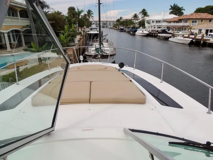  Yacht Photos Pics 2016 Sea Ray 350 Sundancer yacht docked in a canal with waterfront homes.
