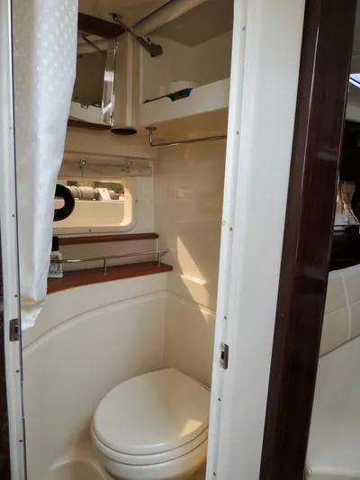  Yacht Photos Pics 2016 Sea Ray 350 Sundancer bathroom with modern amenities and sleek design.