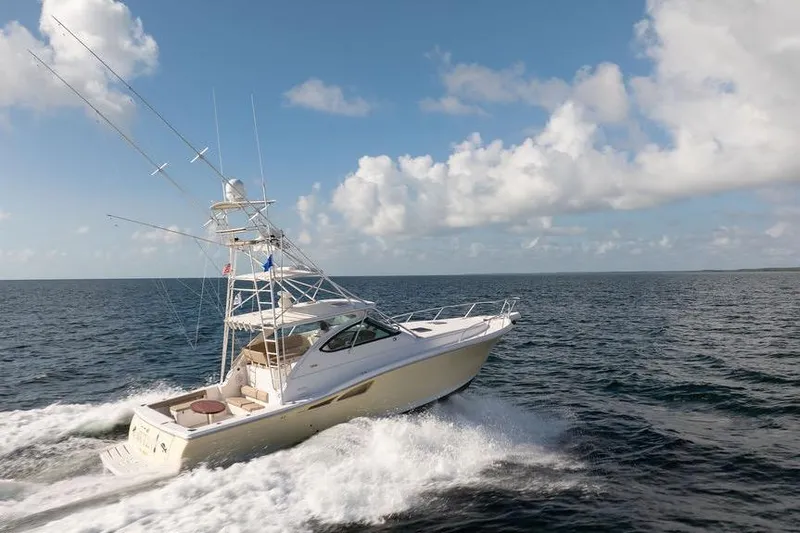  Yacht Photos Pics 2005 Tiara Yachts 4200 Open cruising on open sea under blue sky.