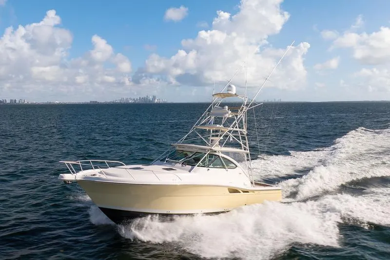  Yacht Photos Pics 2005 Tiara Yachts 4200 Open cruising on open water under a blue sky.