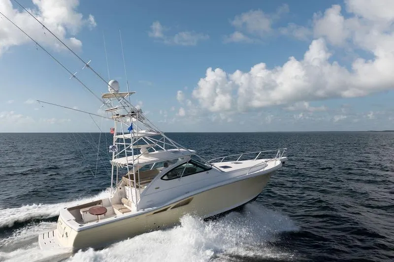  Yacht Photos Pics 2005 Tiara Yachts 4200 Open cruising on open sea under blue sky.