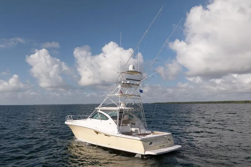  Yacht Photos Pics 2005 Tiara Yachts 4200 Open cruising on open water under a cloudy sky.