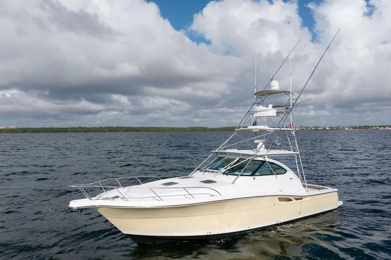  Yacht Photos Pics 2005 Tiara Yachts 4200 Open on calm waters under cloudy sky.