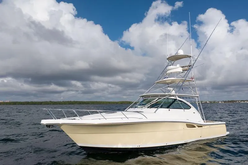  Yacht Photos Pics 2005 Tiara Yachts 4200 Open cruising on open water under cloudy skies.