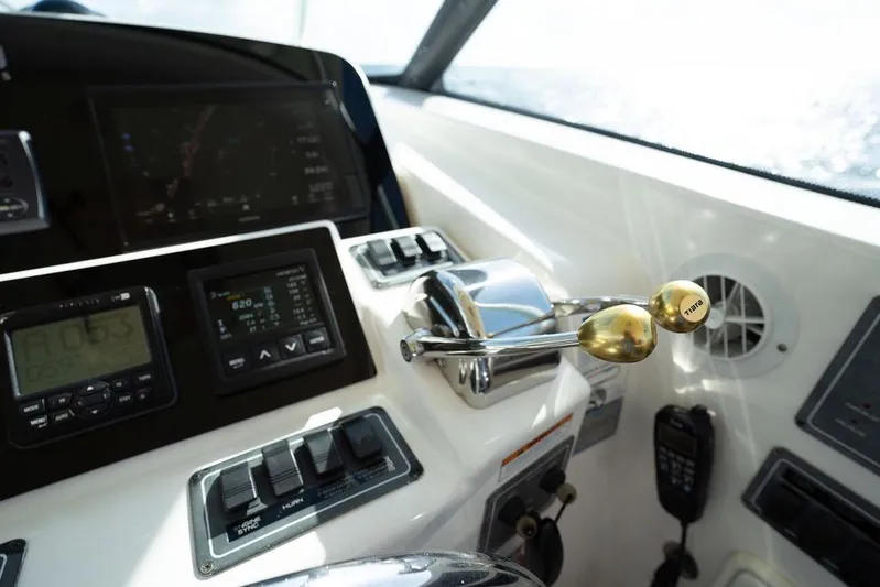  Yacht Photos Pics Control panel of a 2005 Tiara Yachts 4200 Open, featuring navigation and throttle controls.