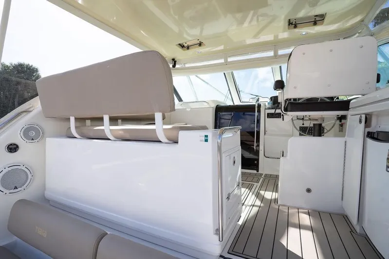  Yacht Photos Pics Interior view of 2005 Tiara Yachts 4200 Open, featuring helm and seating area.