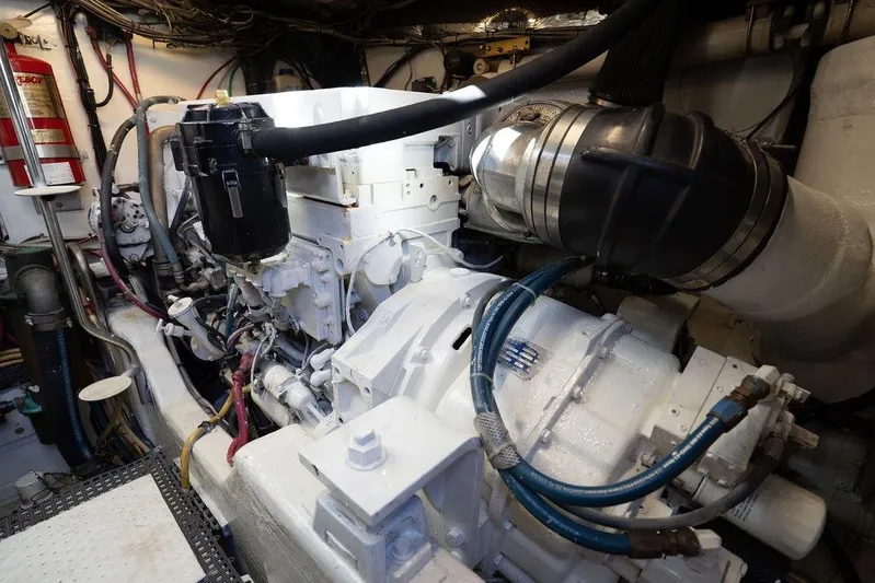  Yacht Photos Pics Engine room of a 2005 Tiara Yachts 4200 Open, showcasing mechanical components.