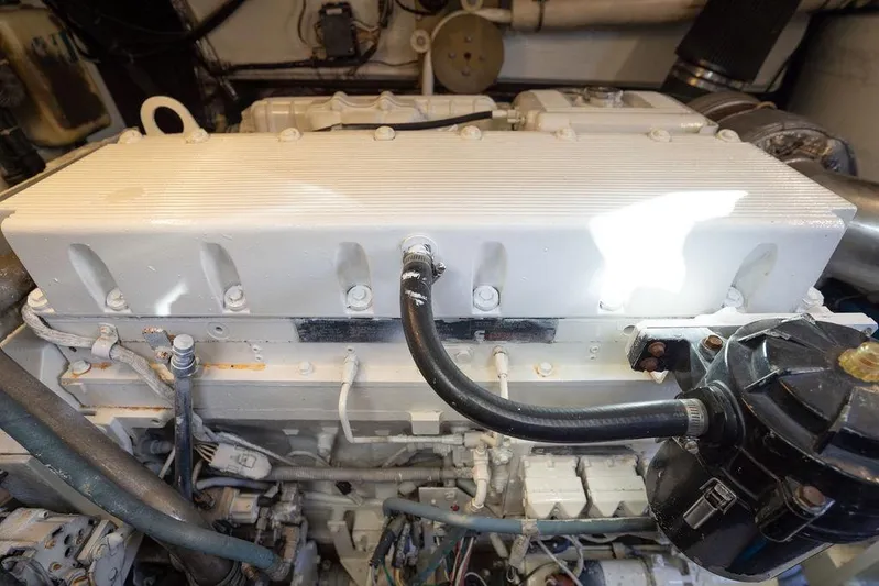  Yacht Photos Pics Engine compartment of a 2005 Tiara Yachts 4200 Open, showcasing mechanical components and hoses.