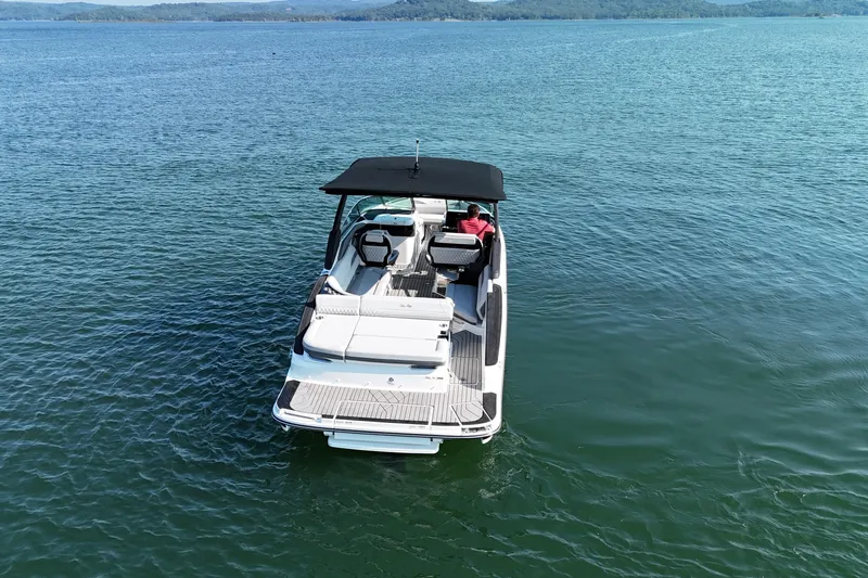  Yacht Photos Pics 2024 Sea Ray SLX 280 boat on calm water, rear view with canopy.