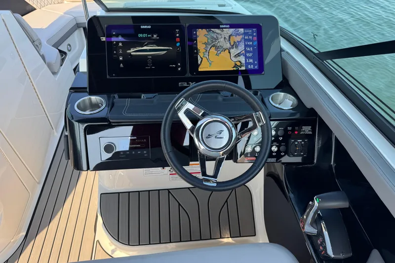  Yacht Photos Pics 2024 Sea Ray SLX 280 helm with dual Simrad displays and modern controls.