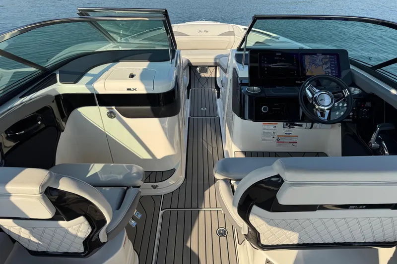  Yacht Photos Pics 2024 Sea Ray SLX 280 boat interior with modern dashboard and luxurious seating.
