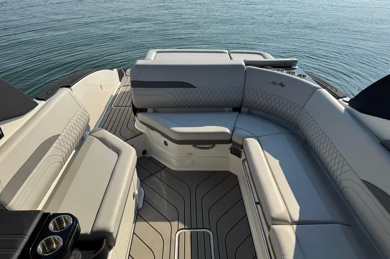  Yacht Photos Pics Luxurious interior of 2024 Sea Ray SLX 280 boat with elegant seating and cup holders.