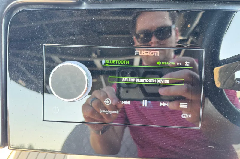  Yacht Photos Pics 2024 Sea Ray SLX 280 dashboard with Fusion Bluetooth audio system display.