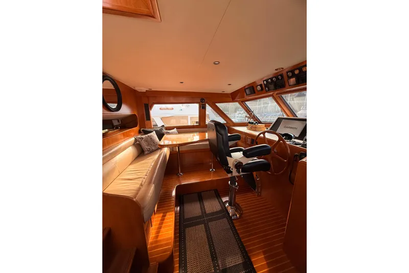 Island Girl Yacht Photos Pics Luxurious 1997 Ocean Alexander 486 Pilothouse interior with helm and seating area.