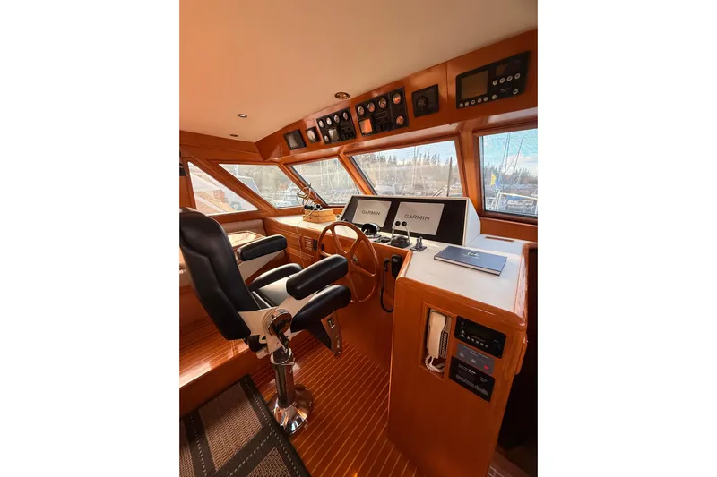 Island Girl Yacht Photos Pics 1997 Ocean Alexander 486 Pilothouse interior with navigation equipment and captain's chair.