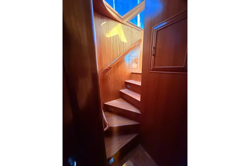 Island Girl Yacht Photos Pics Wooden staircase inside 1997 Ocean Alexander 486 Pilothouse yacht.