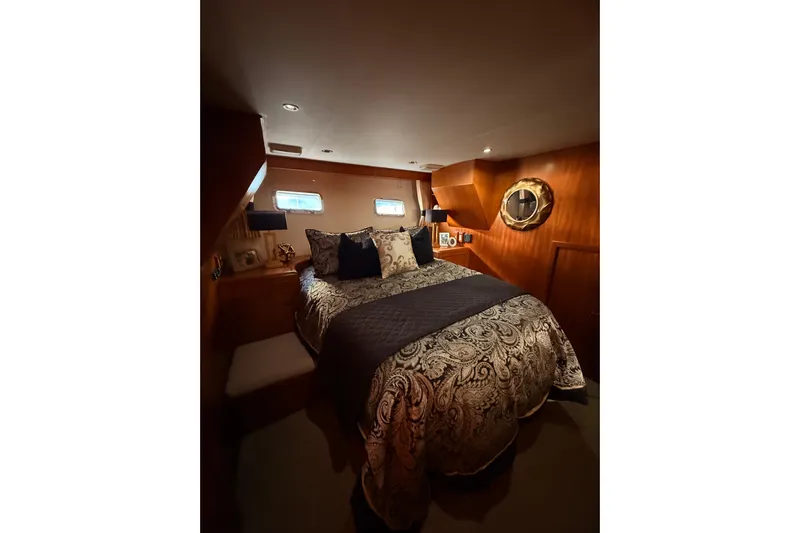 Island Girl Yacht Photos Pics Luxurious bedroom interior of 1997 Ocean Alexander 486 Pilothouse yacht with elegant bedding.