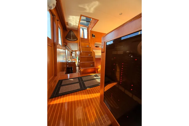 Island Girl Yacht Photos Pics Interior of 1997 Ocean Alexander 486 Pilothouse with wooden flooring and stairs.