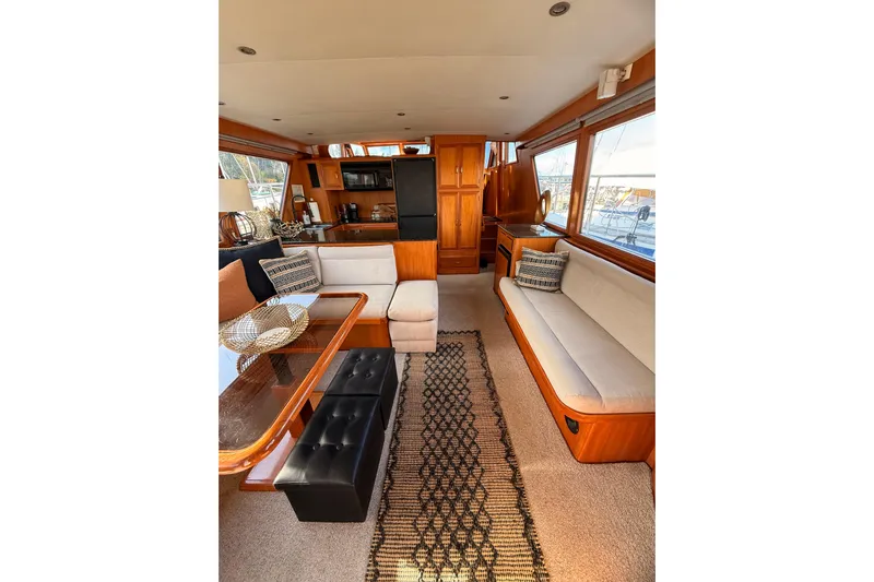 Island Girl Yacht Photos Pics Luxurious interior of 1997 Ocean Alexander 486 Pilothouse yacht with elegant seating and decor.