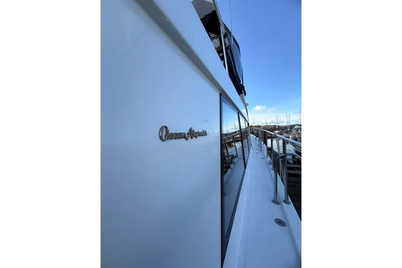 Island Girl Yacht Photos Pics 1997 Ocean Alexander 486 Pilothouse yacht docked at marina, side view.