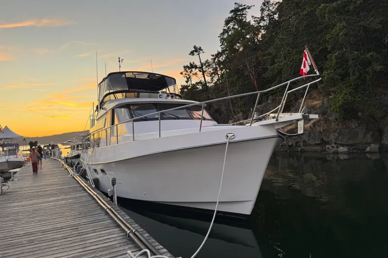 Island Girl Yacht Photos Pics 1997 Ocean Alexander 486 Pilothouse yacht docked at sunset with Canadian flag.