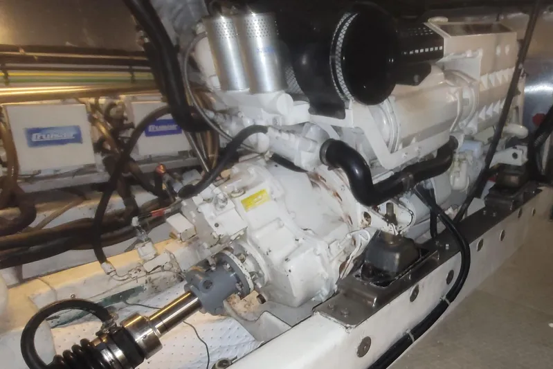 Island Girl Yacht Photos Pics Engine room of a 1997 Ocean Alexander 486 Pilothouse yacht, showcasing mechanical components.