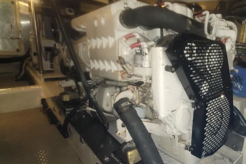 Island Girl Yacht Photos Pics Engine room of 1997 Ocean Alexander 486 Pilothouse yacht, showcasing machinery and components.