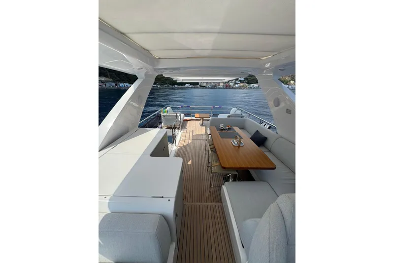  Yacht Photos Pics Luxurious 2024 Azimut 60 yacht interior with elegant seating and dining area on deck.