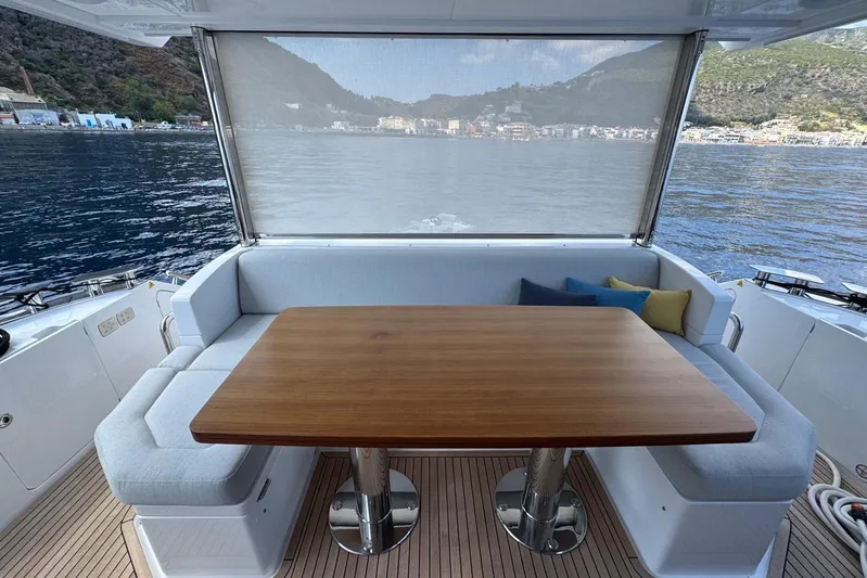  Yacht Photos Pics Luxurious 2024 Azimut 60 yacht deck with elegant seating and scenic ocean view.