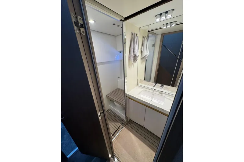  Yacht Photos Pics Luxurious bathroom in 2024 Azimut 60 yacht with modern fixtures and elegant design.