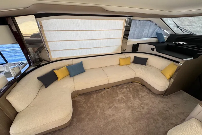  Yacht Photos Pics Luxurious interior of 2024 Azimut 60 yacht with elegant beige seating and colorful cushions.