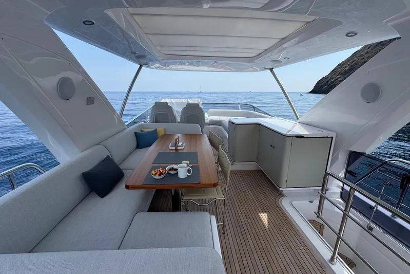  Yacht Photos Pics Luxurious 2024 Azimut 60 yacht interior with elegant seating and ocean view.