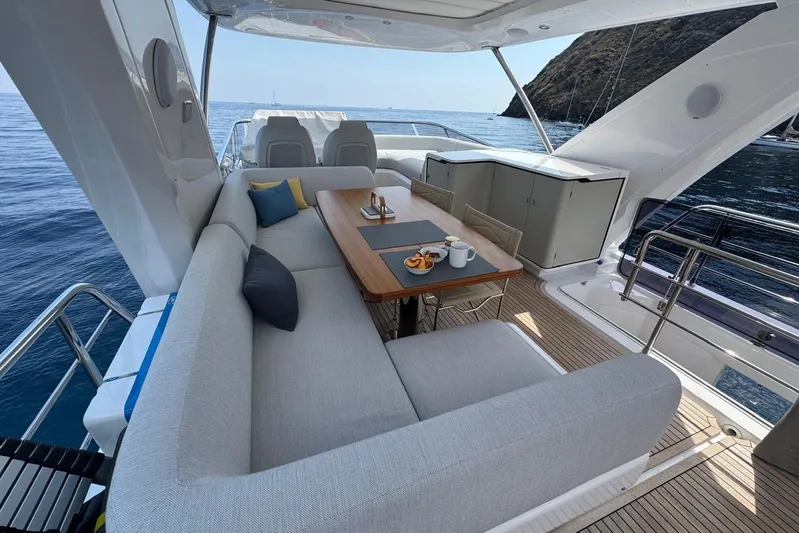  Yacht Photos Pics Luxurious 2024 Azimut 60 yacht deck with elegant seating and ocean view.