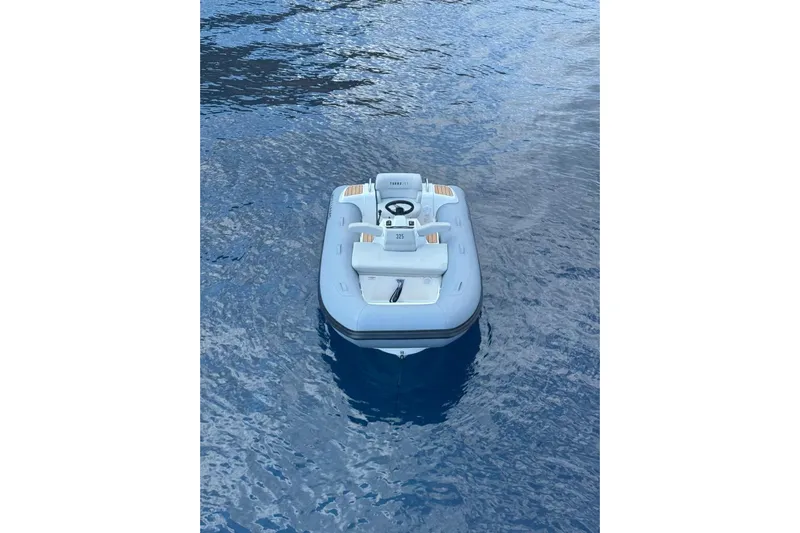  Yacht Photos Pics Inflatable boat on water, associated with 2024 Azimut 60 yacht.