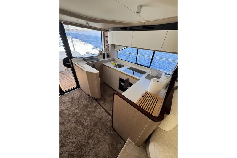  Yacht Photos Pics Luxurious interior of 2024 Azimut 60 yacht with modern kitchen and ocean view.