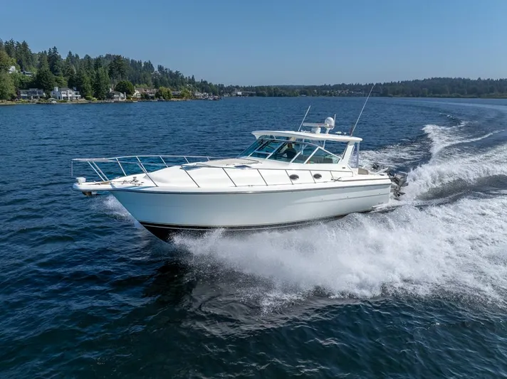  Yacht Photos Pics 2001 Tiara Sport 4000 EXPRESS cruising on a scenic lake.