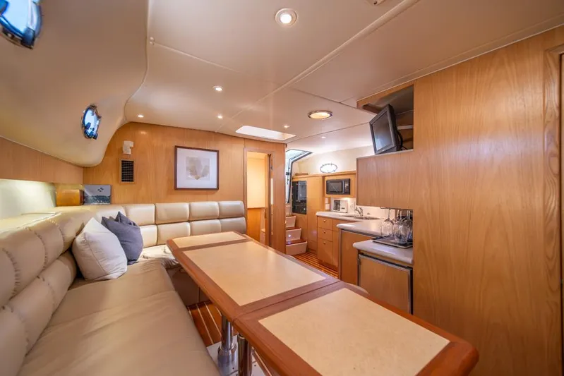  Yacht Photos Pics Luxurious interior of 2001 Tiara Sport 4000 EXPRESS yacht with modern amenities and cozy seating.