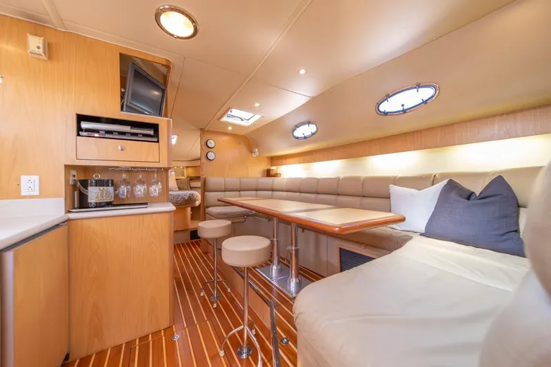  Yacht Photos Pics Luxurious interior of 2001 Tiara Sport 4000 EXPRESS yacht with modern amenities and seating.