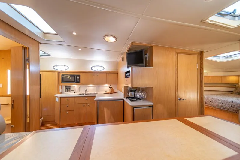  Yacht Photos Pics Luxurious interior of 2001 Tiara Sport 4000 EXPRESS yacht with modern kitchen amenities.