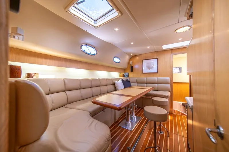  Yacht Photos Pics Luxurious interior of 2001 Tiara Sport 4000 EXPRESS yacht with plush seating and wooden accents.