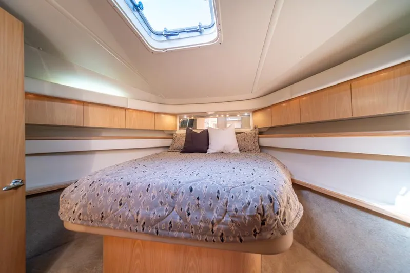  Yacht Photos Pics Luxurious cabin interior of 2001 Tiara Sport 4000 EXPRESS yacht with cozy bedding.