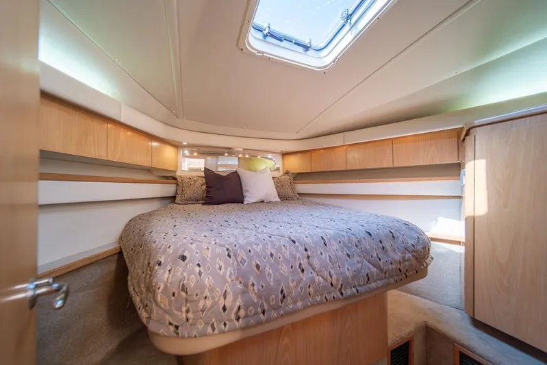  Yacht Photos Pics Luxurious cabin interior of 2001 Tiara Sport 4000 EXPRESS yacht with cozy bedding.