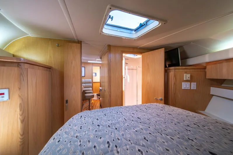 Yacht Photos Pics Interior cabin of 2001 Tiara Sport 4000 EXPRESS yacht, featuring wood paneling and a skylight.