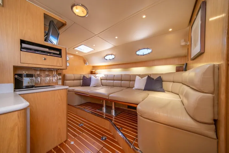  Yacht Photos Pics Luxurious interior of 2001 Tiara Sport 4000 EXPRESS yacht with plush seating and elegant wood finishes.