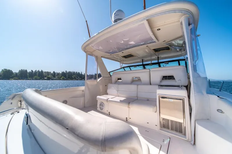  Yacht Photos Pics 2001 Tiara Sport 4000 EXPRESS yacht interior with seating, on a sunny day by the water.