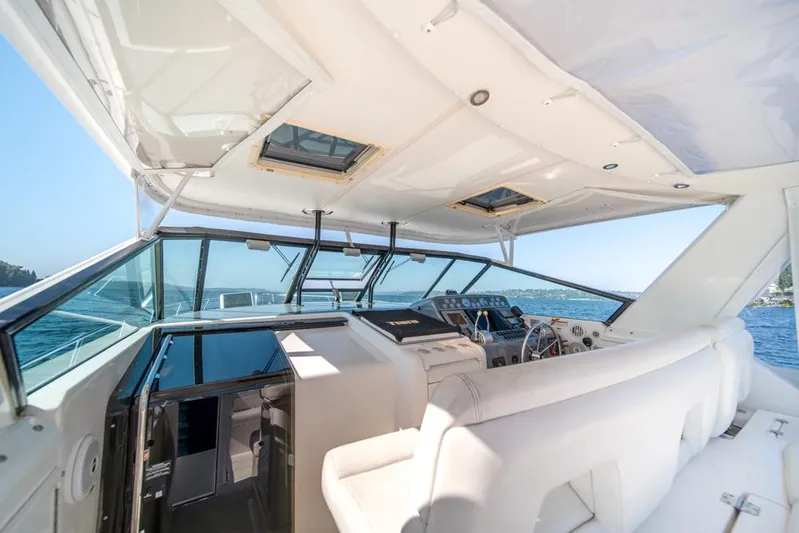  Yacht Photos Pics Interior view of 2001 Tiara Sport 4000 EXPRESS yacht cockpit with white seating.