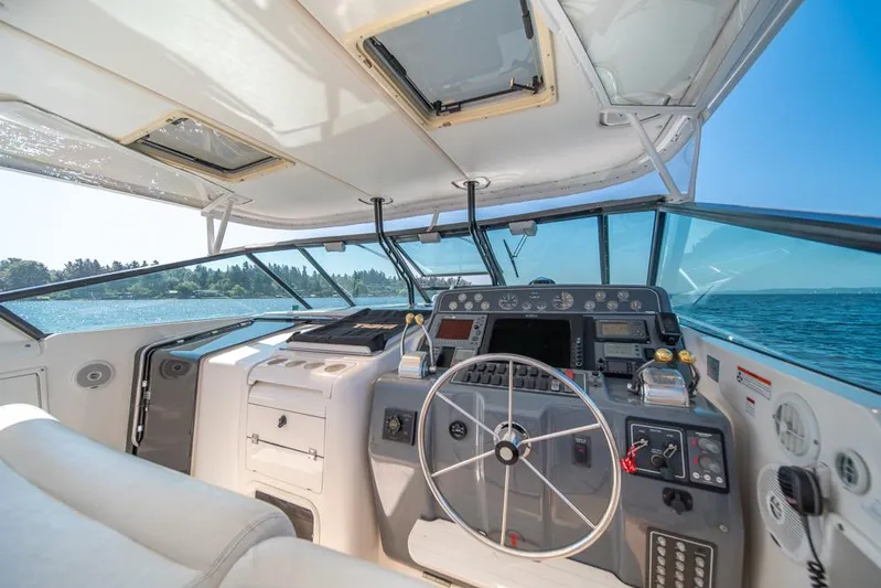  Yacht Photos Pics Interior view of 2001 Tiara Sport 4000 EXPRESS yacht cockpit with steering wheel and controls.