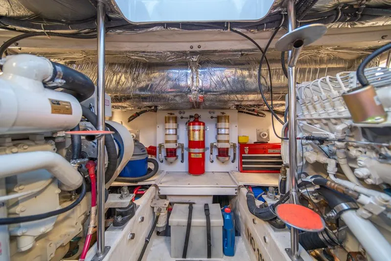  Yacht Photos Pics Engine room of 2001 Tiara Sport 4000 EXPRESS yacht, featuring machinery and safety equipment.