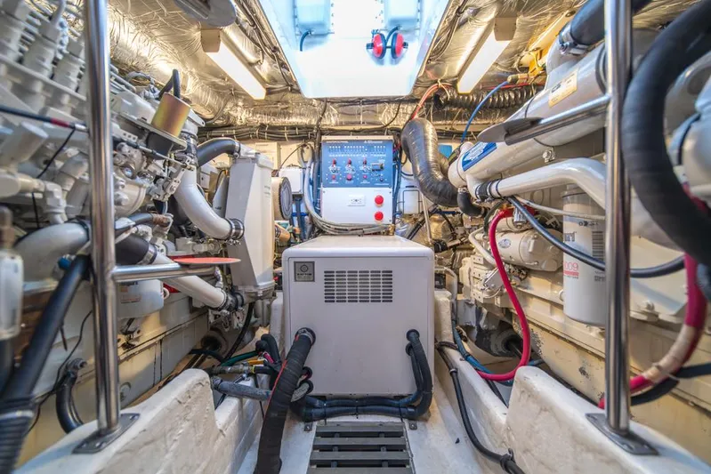  Yacht Photos Pics Engine room of 2001 Tiara Sport 4000 EXPRESS, showcasing machinery and control panel.