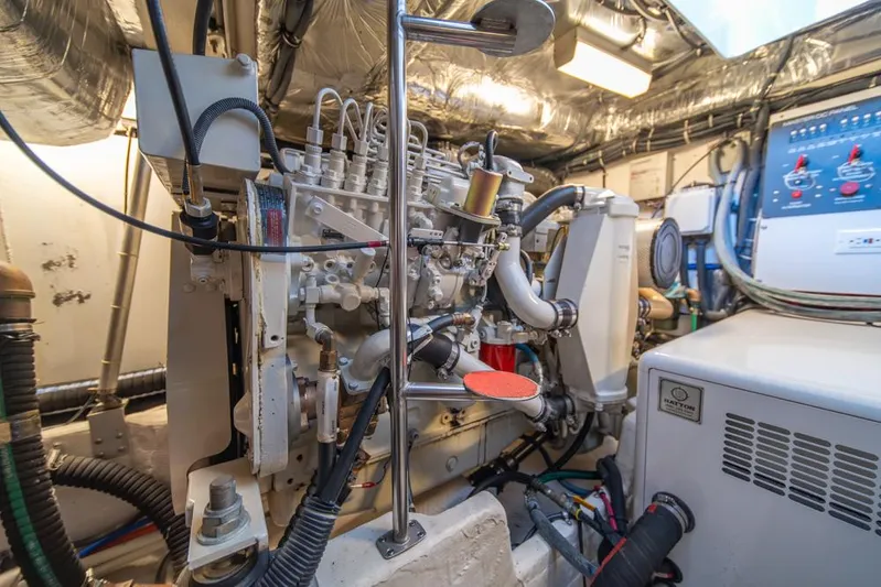  Yacht Photos Pics Engine room of 2001 Tiara Sport 4000 EXPRESS yacht, showcasing mechanical components and wiring.